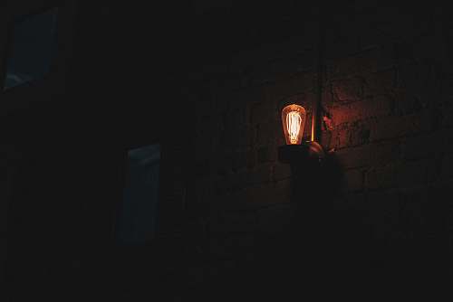 person lighted wall sconce people
