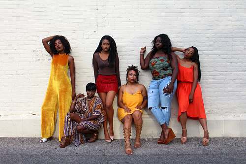 people six women leaning on white wall person
