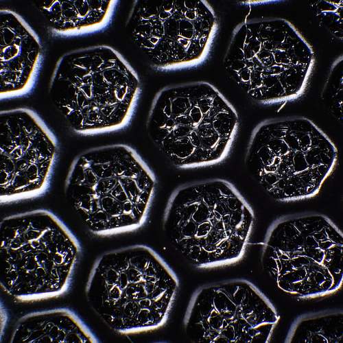 ornament macro photography of gray honeycomb surface black