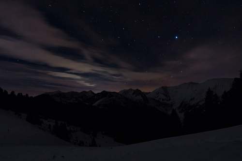 black gray and white mountain hill under starry night outdoors