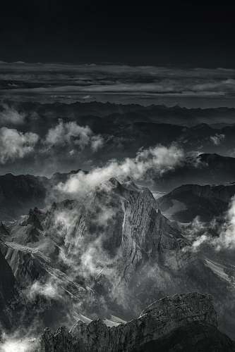 alps grayscale photo of mountain range mountain