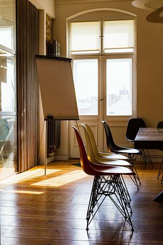 floor black metal base chairs inside room wood