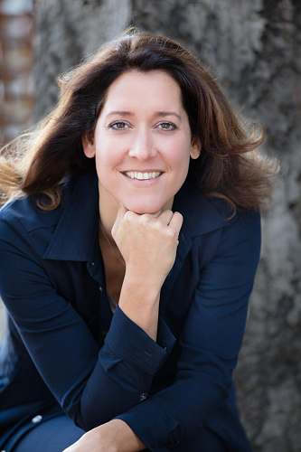 apparel smiling woman with hand on chin clothing