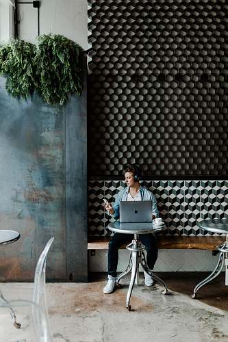 human man sitting on chair sitting