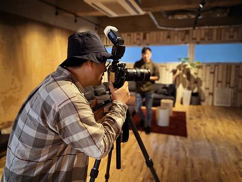 human man taking photo tripod