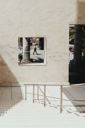 grey woman walking on a street city
