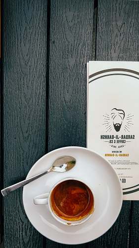 cutlery coffee in white ceramic mug near teaspoon pottery